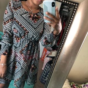 A long-sleeved black and white high-low dress